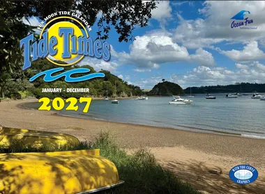 Cover of the New Zealand Tide Times Calendar 2027 — yellow kayaks on a Northland beach